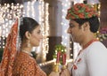 Couple performing Dandiya Raas on Navratri