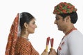 Couple performing Dandiya Raas at Navratri