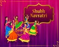 Couple performing Garba dance in Dandiya Raas for Dussehra or Navratri