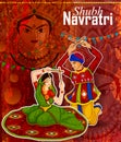 Couple performing Garba dance in Dandiya Raas for Dussehra or Navratri