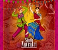 Couple performing Garba dance in Dandiya Raas for Dussehra or Navratri