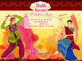 Couple performing Garba dance in Dandiya Raas for Dussehra or Navratri