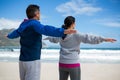 Couple performing stretching exercise Royalty Free Stock Photo