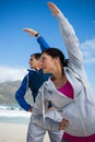 Couple performing stretching exercise Royalty Free Stock Photo