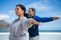 Couple performing stretching exercise Royalty Free Stock Photo