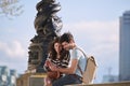 Couple, phone and travel holiday while at statue doing search on internet for map information on tourist trip. Man and Royalty Free Stock Photo