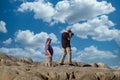 Couple Photographing on Rocks