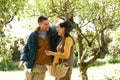 Couple picking apples in garden