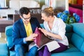 Couple picking couch seat cover in furniture store Royalty Free Stock Photo