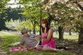 Portrait of Couple Picnicking in Orchard