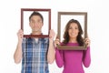 Couple with picture frames. Royalty Free Stock Photo