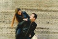 Couple in piggyback having a good time of laughter and love to celebrate their upcoming wedding Royalty Free Stock Photo