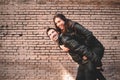 Couple in piggyback having a good time of laughter and love to celebrate their upcoming wedding Royalty Free Stock Photo