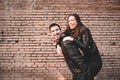 Couple in piggyback having a good time of laughter and love to celebrate their upcoming wedding Royalty Free Stock Photo