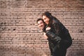 Couple in piggyback having a good time of laughter and love to celebrate their upcoming wedding Royalty Free Stock Photo