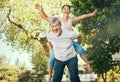 Couple, piggyback and nature to smile in portrait, excited and playful in freedom, energy and joy. Happy elderly asian