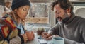 Couple plan travel destination from inside a camper van. Man and woman indoor leisure activity together in modern motor home