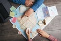 Couple are planning Camino de Santiago in Spain. Table with map and compass and hands from above. Top view Royalty Free Stock Photo