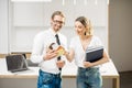 Couple planning home interior in the kitchen Royalty Free Stock Photo