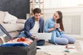 Couple planning trip, studying map at home Royalty Free Stock Photo