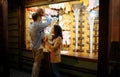 Couple play in shooting gallery, amusement park Royalty Free Stock Photo