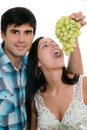 Couple playfully eating grapes Royalty Free Stock Photo