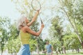 couple playing badminton outdoors Royalty Free Stock Photo