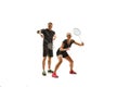 Couple playing with badminton rackets isolated on white Royalty Free Stock Photo