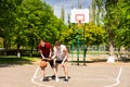 Couple Playing Basketball on Outdoor Court Royalty Free Stock Photo