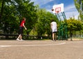 Couple Playing Basketball on Outdoor Court Royalty Free Stock Photo