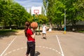 Couple Playing Basketball on Outdoor Court Royalty Free Stock Photo