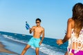 Couple playing beach tennis.