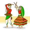 Couple playing Dandiya