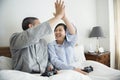 A couple playing game together in bed Royalty Free Stock Photo
