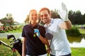 Couple playing golf on a sunny day - Image Royalty Free Stock Photo