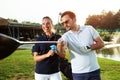 Couple playing golf on a sunny day - Image Royalty Free Stock Photo