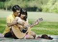 Couple playing guitar