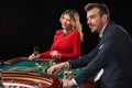 Couple playing roulette wins at the casino. Royalty Free Stock Photo