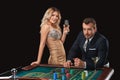 Couple playing roulette wins at the casino. Royalty Free Stock Photo