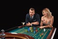 Couple playing roulette wins at the casino. Royalty Free Stock Photo