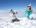 Couple playing with snowballs