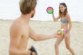 couple playing sticky ball game at beach Royalty Free Stock Photo