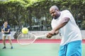 Couple playing tennis as a team Royalty Free Stock Photo