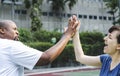 Couple playing tennis as a team Royalty Free Stock Photo