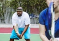 Couple playing tennis as a team Royalty Free Stock Photo