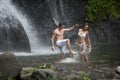 Couple Playing Under Waterfalls Royalty Free Stock Photo
