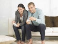 Couple Playing Video Game On Sofa Royalty Free Stock Photo