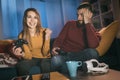 Couple playing video games at home Royalty Free Stock Photo