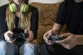 Couple playing video games at home. Playful people ,gaming lifestyle, friends having fun together concept Royalty Free Stock Photo