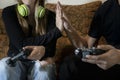 Couple playing video games together at home.Man and woman celebrating game victory .Concept of fun, playful friends lifestyle with